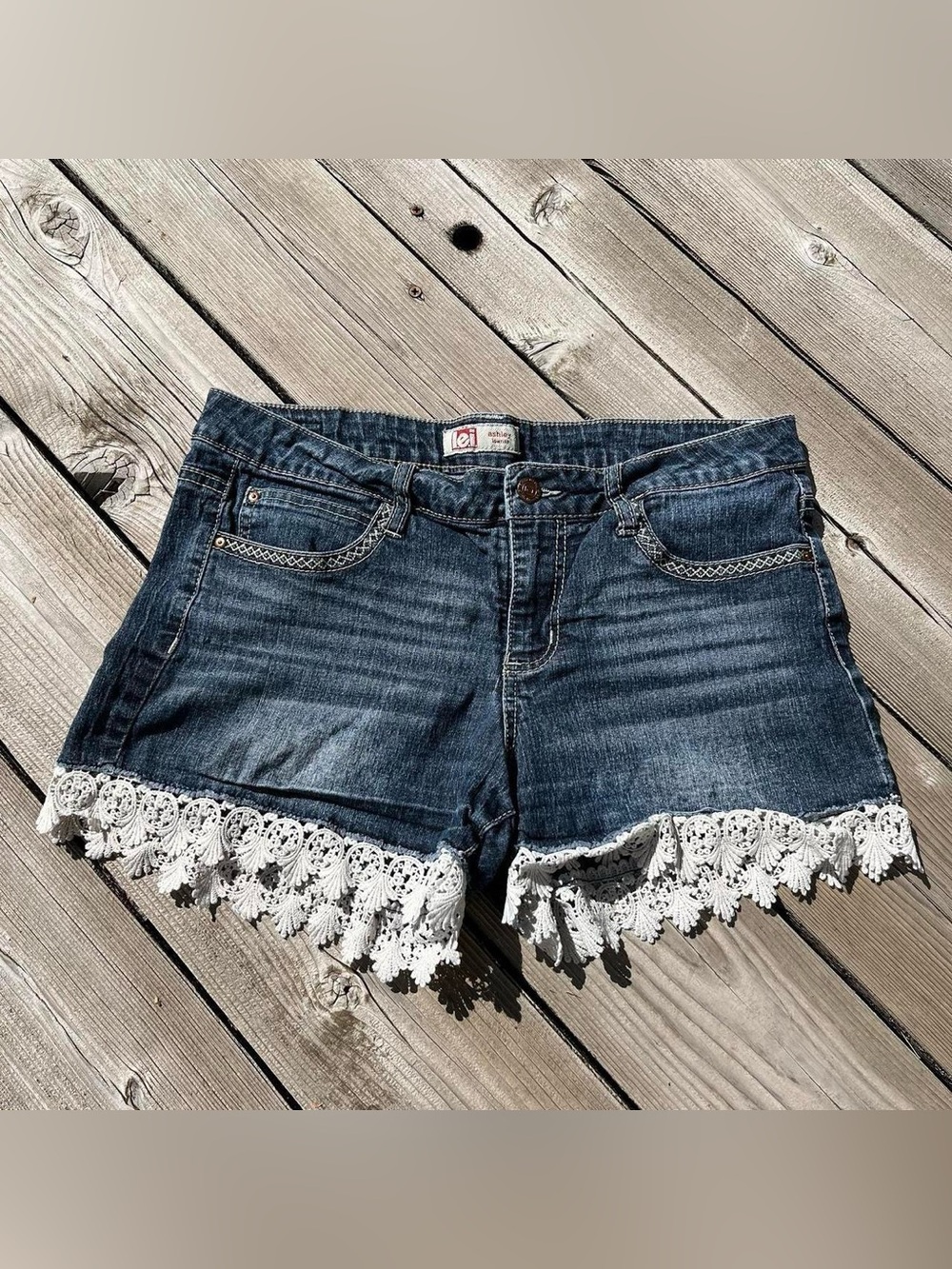 lei low rise crochet hem jean shorts